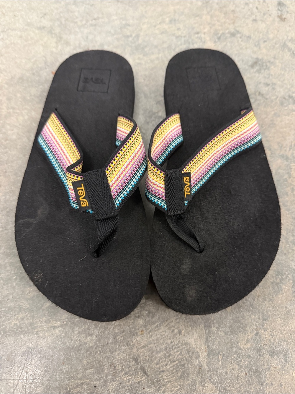Teva Kids Black Flip Flops with Rainbow Striped Straps
